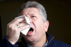 sneezing man