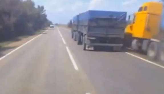 truck flips passing right