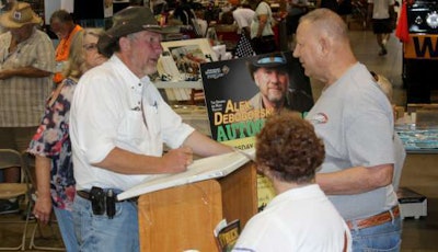 Alex Debogorski signs autographs at the ATHS convention in 2015