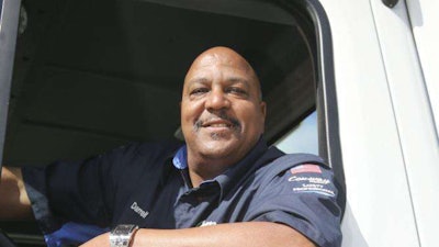 Con-way Freight driver Darrell Thompson celebrates 3 million accident-free miles at the company's service center in Plainfield, Ind., Tuesday, May 19, 2015. (AJ Mast/AP Images for Con-way Freight)