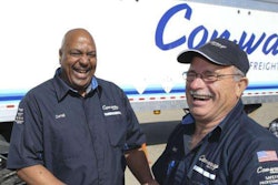 Con-way Freight driver Darrell Thompson, left, is congratulated by fellow driver Gary Felton on driving 3 million accident free miles at the company's service center in Plainfield, Ind., Tuesday, May 19, 2015. Felton, a long time friend of Thompson, is also a 2 million mile accident free driver. (AJ Mast/AP Images for Con-way Freight)