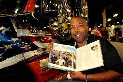 Randy Twine shows off the Ride of Pride section of Schneider's history.
