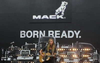 Kylie Rae Harris performs at the Mack booth