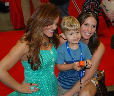 Singer/songwriter Lindsay Lawler (left) and friends at the Schneider booth
