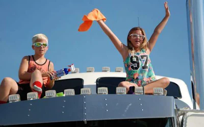 Mason Martin and Jocelyn Moses atop Brian Martin's 2003 Kenworth