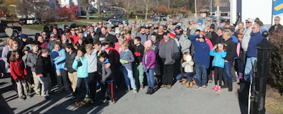 Volunteers who helped unload trucks and lay wreaths on graves