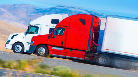 two-trucks-on-highway