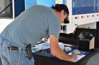 A Boyd Brothers employee signs up for the Truckers Against Trafficking newsletter.