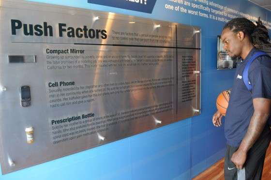 A Boyd Brothers employee reads the stories of human trafficking victims inside the Freedom Drivers Project trailer. (Photos by Deanne Winslett)