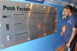 A Boyd Brothers employee reads the stories of human trafficking victims inside the Freedom Drivers Project trailer. (Photos by Deanne Winslett)