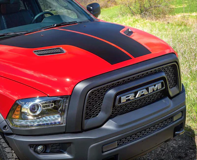 The Mopar ’16 Ram Rebel’s aluminum, dual bezel sport performance hood is embellished with a matte-black hood graphic.