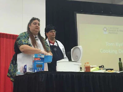 Jennifer Cordero (left) and Tom Kyrk (right), both truckers, led a demonstration at GATS on how to cook in the truck. (Photo: Deanne Winslett)