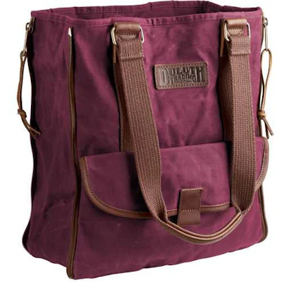 Gusseted oil cloth bag expands as you fill it up. Numerous pockets. Magnetic clasp closes the top. 12 1/2' W x 5 1/2' D x 15' H. $64.50