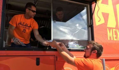 Hirschbach President & CEO Brad Pinchuk serves lunch at a Truck Driver Appreciation event.