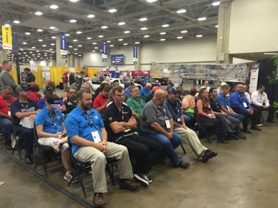 The nine Trucking's Top Rookie finalists sit in the first row during the ceremony at the Great American Trucking Show.