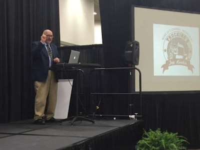 Truckers News Editor David Hollis leads the ceremony during the Great American Trucking Show.