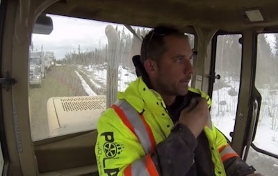 Polar Enterprises owner Mark Kohaykewych about to cross a frozen lake in a front loader. (History Channel photo)