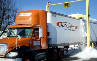 A. Duie Pyle truck having snow removed.