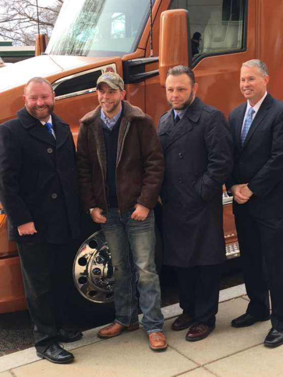 Troy Davison, Kevin Scott, Russell Hardy and Brad Bentley, with Fastport, stand in front of Davidson&rsquo;s new Kenworth T680.