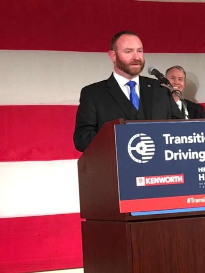 Troy Davidson accepts the Transition Trucking award for America's top military rookie driver of the year.