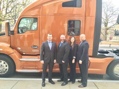 From left to right: Jim Morbach, associate vice president of Werner’s student and government recruiting, Troy Davidson, award winner and Werner driver, Lauren Woods, manager of Werner’s military and special programs, and Rick Buchholz, associate director of Werner’s field and government recruiting, stand in front of Davidson’s new truck. (Image Courtesy of Werner)