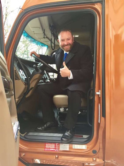 Troy Davidson sits inside his new Kenworth T680.