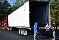 Robert Lilley and his rider Charlene Ayscue speak with WAA organizer George Winslow outside their truck at Jefferson Memorial Gardens.