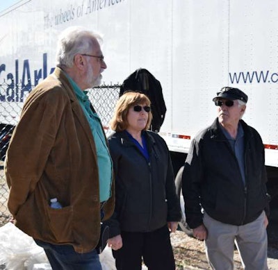 Pohl chats with Wreaths Across America volunteers as her truck gets unloaded.