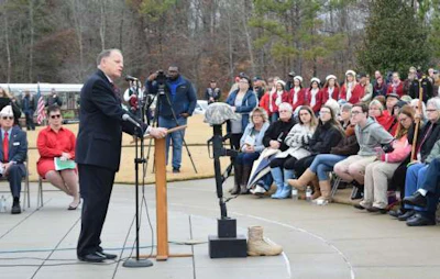 Army veteran Doug Carver speaks to the crowd at Alabama National Cemetery on National Wreaths Across America Day.