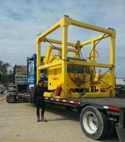 De La Rosa stands next to her truck loaded with an oversize load. (Image Courtesy of Cynthia De La Rosa)