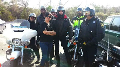 De La Rosa poses for a picture with members of her escort for her oversize load. (Image Courtesy of Cynthia De La Rosa)