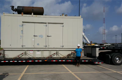 De La Rosa poses for a picture with one of her oversize loads. (Image Courtesy of Cynthia De La Rosa)