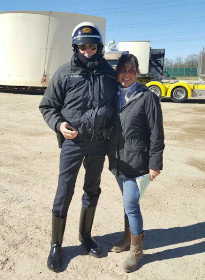 De La Rosa, right, stands with a member of one of her escorts. (Image Courtesy of Cynthia De La Rosa)