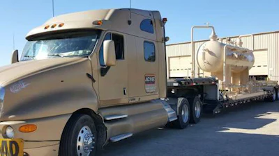 De La Rosa's truck gets loaded with an oversize load. (Image Courtesy of Cynthia De La Rosa)