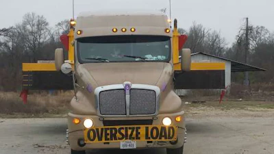 An 'Oversize Load' banner is affixed to the front of De La Rosa's truck. (Image Courtesy of Cynthia De La Rosa)