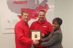 Jennifer Wade (right) of the Missouri Division of Workplace Development presents the Flag of Freedom award to Averitt Express’ St. Louis service center director Scot Hollocher (left) and driver Joseph Ailshie (center). Ailshie served in the United States Marine Corps during operations Desert Shield and Desert Storm.