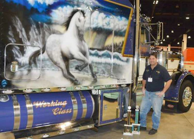 Trucker Colin Stuart stands next to his show truck, 'Working Class,' at the 2016 Mid-West Truck & Trailer Show. (Image Courtesy of Mid-West Truckers Association)