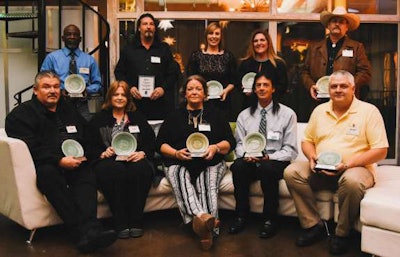 Front Row – Left to Right: David Barnes (Team Driver- recently retired), Linda Barnes (Team Driver- recently retired), Star Hall (OTR Driver), Mark Cavanagh (OTR Driver), Danny Garman (Dedicated Driver), Back Row – Left to Right: Handy King (Flatbed Driver), John Martin (Driver Trainer), Julie Anderson (Finance Department), Janene Morris (Recruiting Department), Brian Evans (Owner Operator).