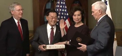Secretary of Transportation Elaine Chao sworn in by Vice President Mike Pence (right) with her husband Sen. Mitch McConnell (left) and Chao’s father James S.C. Chao