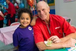 Tampa service center director Dick Wiggins spends time with a St. Jude Children’s Research Hospital patient as part of Averitt Express’ recent trip to the Memphis facility to present a donation from Averitt’s employees.