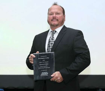 Christopher Loftus with his Household Goods award at a formal ceremony by the American Moving & Storage Association. (Image Courtesy of AMSA)