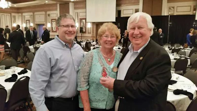 John Whittington (left), Ro Whittington (middle) and Shorty Whittington (right) with Grammer Industries’ award from the Columbus, Indiana Chamber of Commerce. (Image Courtesy of Shorty Whittington)