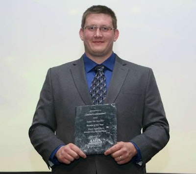 Daniel Lobbestael with his Rookie of the Year award at a formal ceremony by the American Moving & Storage Association. (Image Courtesy of AMSA)