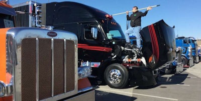 Terry Beine of Jackson, Wisconsin gets one of the many show trucks at MATS ready for the judges