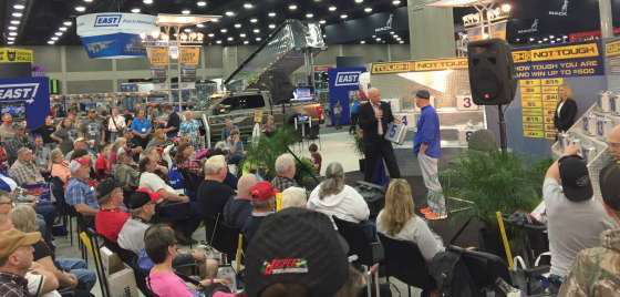 MATS attendees watch a 'Deal or No Deal'-themed game during the show.