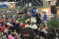 MATS attendees watch a 'Deal or No Deal'-themed game during the show.