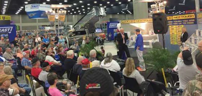 MATS attendees watch a 'Deal or No Deal'-themed game during the show.