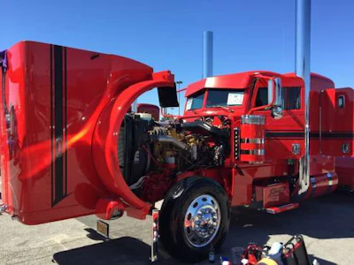 A custom truck on display at the truck show lot.
