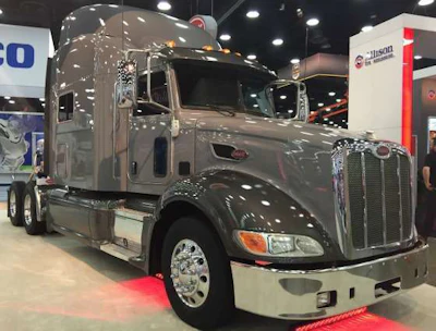 A grey, newer model Peterbilt on display at the manufacturer's MATS booth.