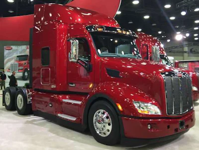 A red, newer model Peterbilt on display at the manufacturer's MATS booth.